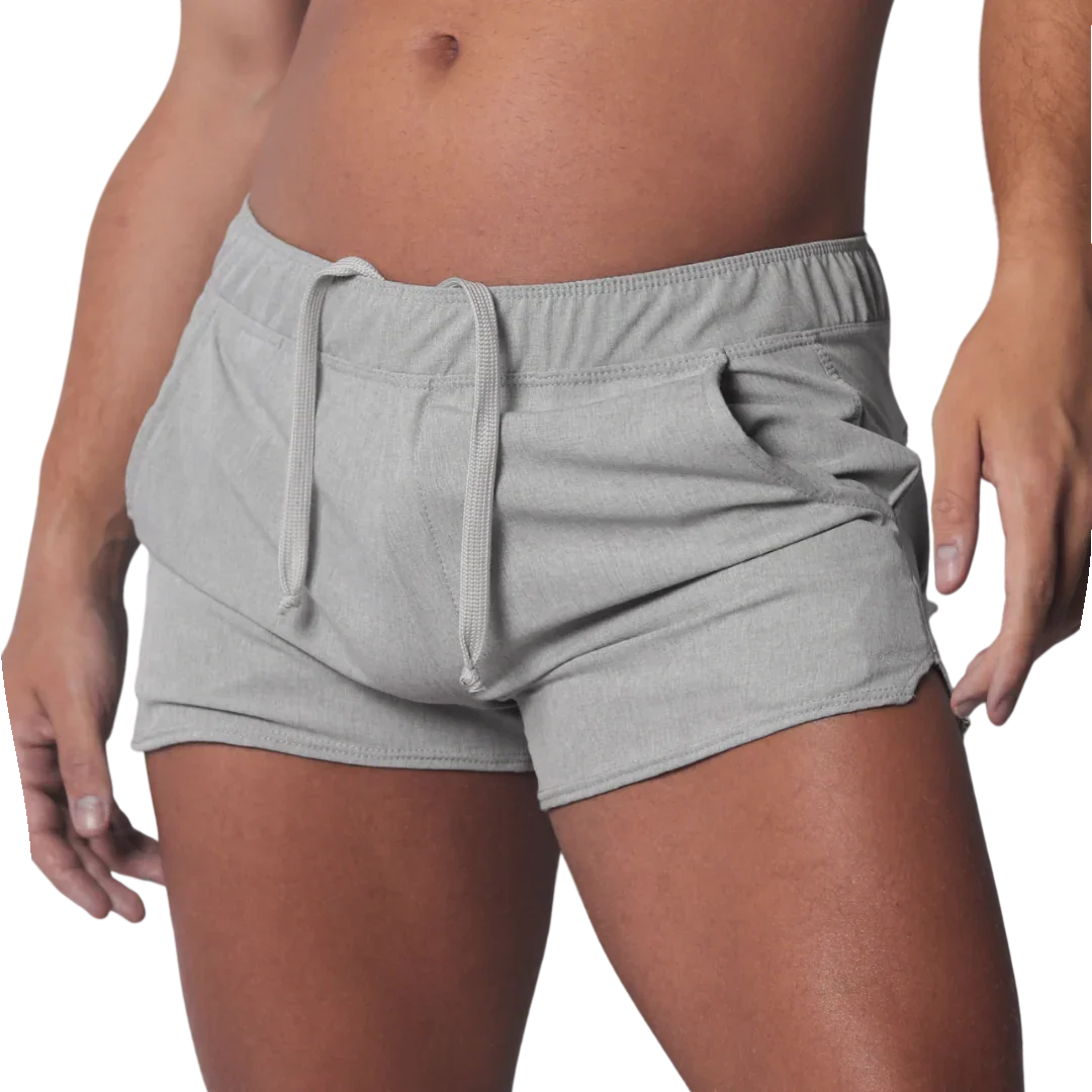 Gray mid-thigh athletic shorts with an elastic drawstring waistband and curved hem side slits.