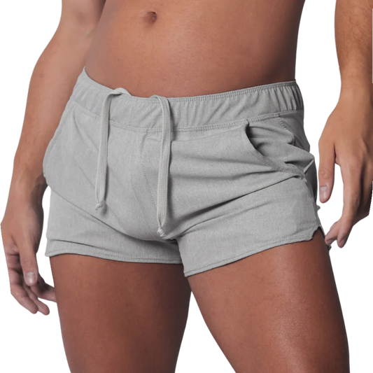 Gray mid-thigh athletic shorts with an elastic drawstring waistband and curved hem side slits.