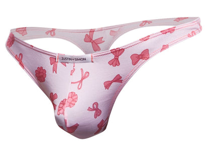 Pink bow-patterned thong by justin simon in coquette color made of soft classic fabric shown from the back side