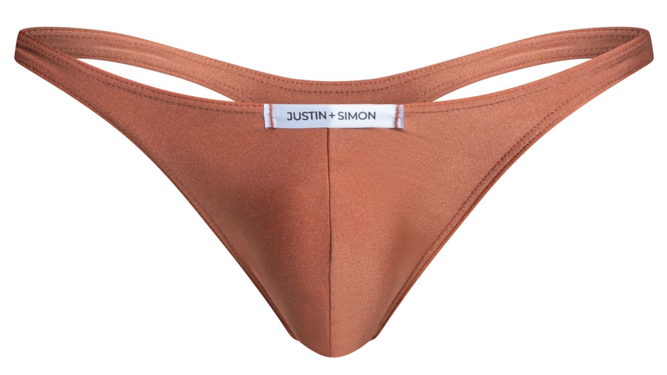 A sleek rust-colored thong made of smooth fabric with minimalist design and justin + simon brand label center front