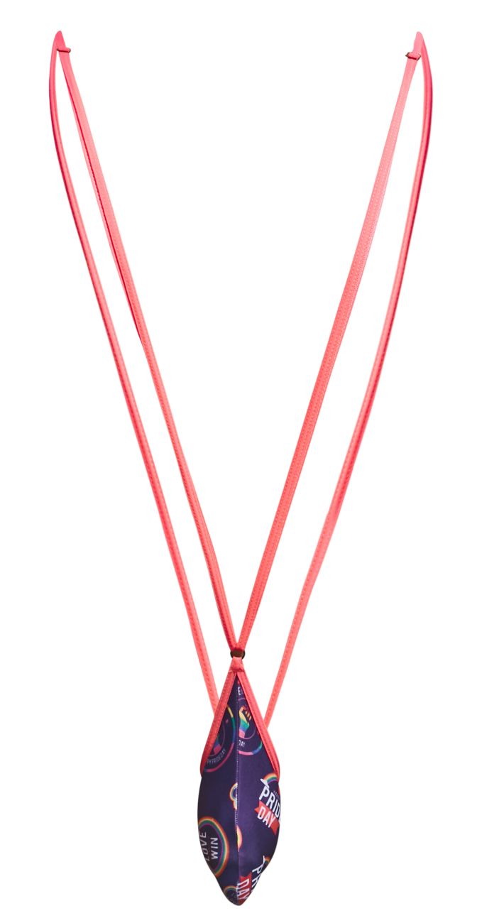 A vibrant pink corded sling necklace with a teardrop pendant featuring a purple and gold sports-themed print from justin simon