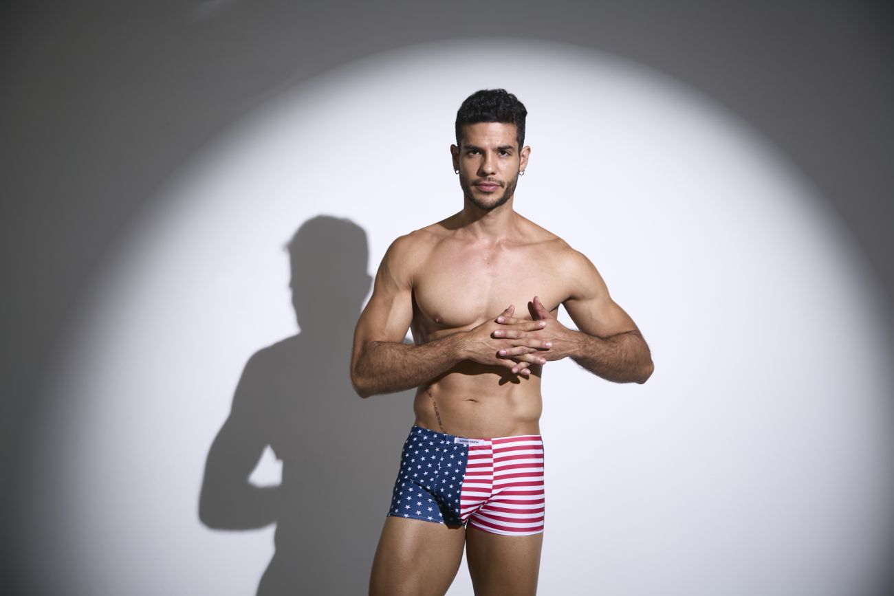 A man wearing justin simon xsj08 classic boxer briefs with american flag pattern in red white and blue colors