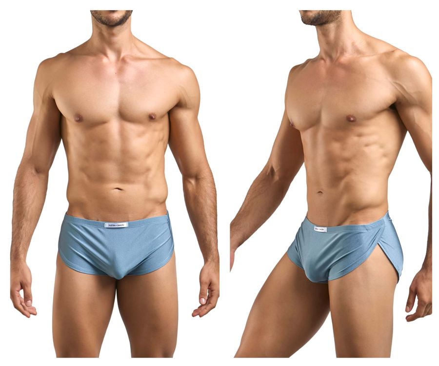 Light blue smooth textured men’s briefs with side slit and white brand tag shown with justin simon xsj09 running shorts metal green