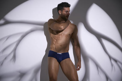 Navy blue cheeky bulge boxer with white logo waistband from JUSTIN+SIMON XSJ13 in peach navy color