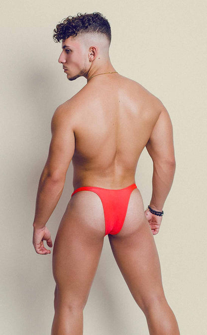 Vibrant red joe snyder polyester capri thong in smooth stretch fabric shown from the back side