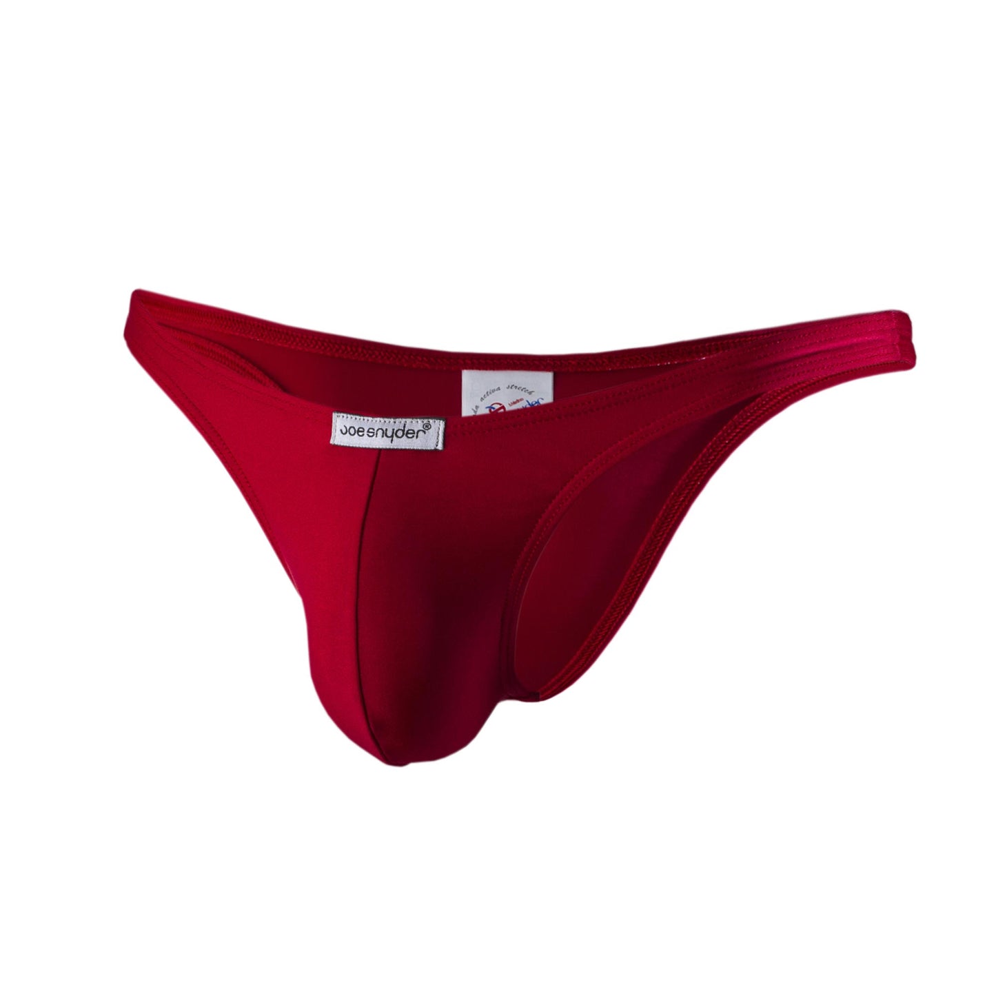 A vibrant red joe snyder polyester capri thong made of smooth stretchy fabric with a branded label showing the back side
