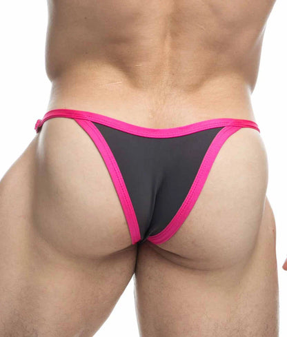Black and pink Justin + Simon bikini thong with snug fit and vibrant fuchsia trim along the edges back side view