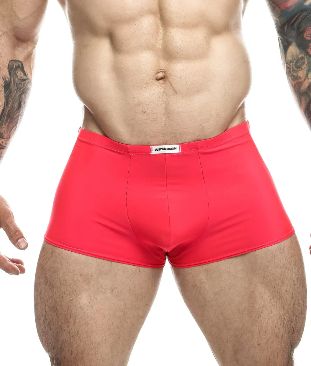 Bright red form-fitting briefs with justin simon white label at waistband from justin simon classic boxer final sale