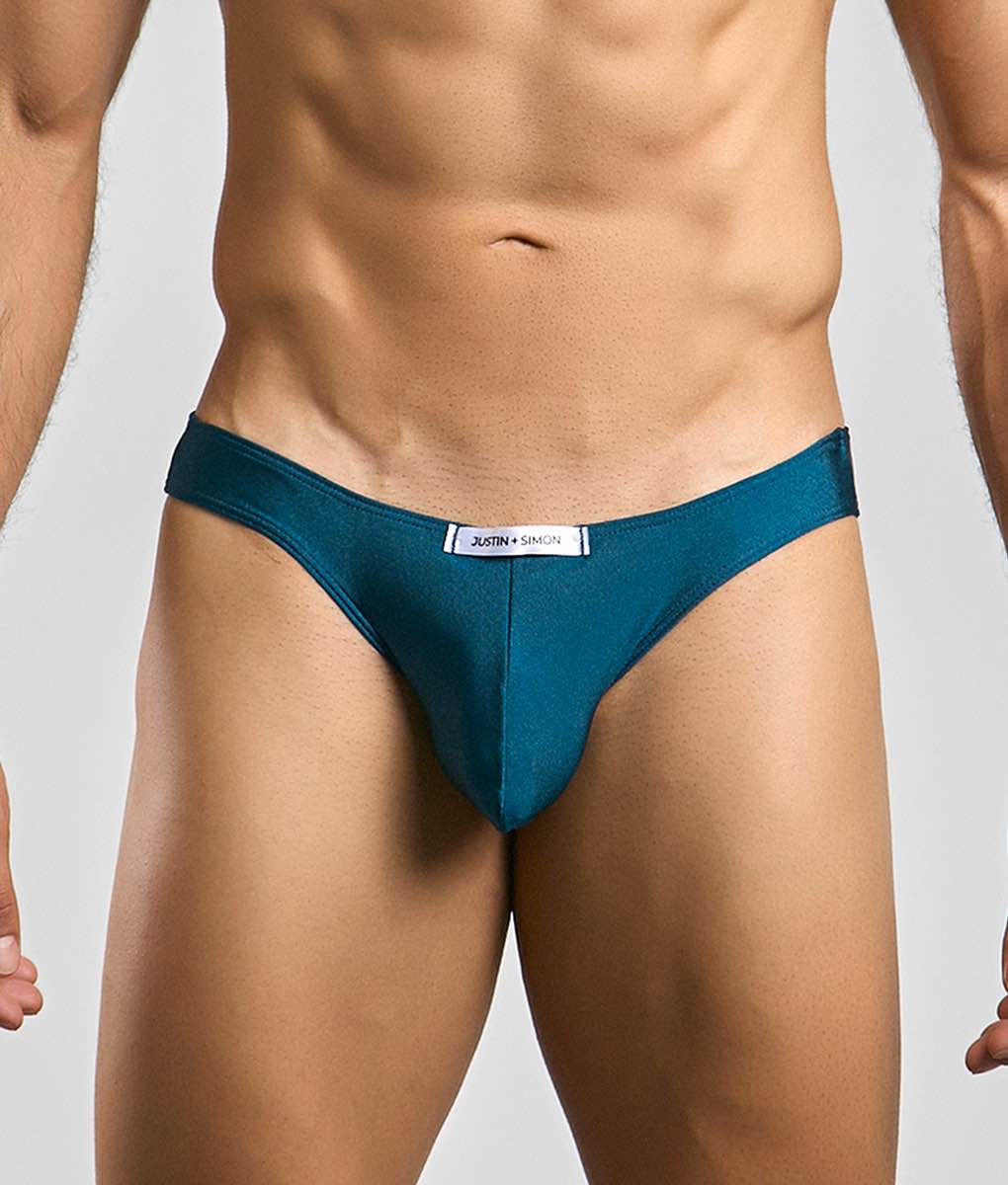 Teal classic mens bikini briefs by justin simon with sleek smooth fabric and white label at the waistband