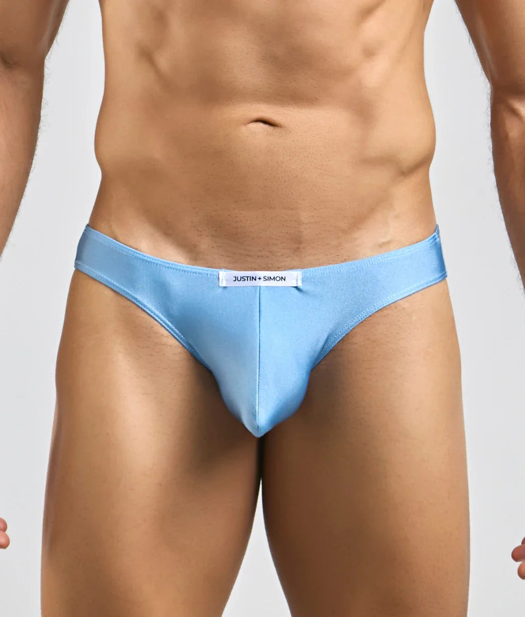 Light blue justin simon classic mens bikini briefs with sleek form fitting design and subtle brand tag at waistband