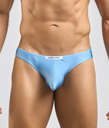 Light blue justin simon classic mens bikini briefs with sleek form fitting design and subtle brand tag at waistband