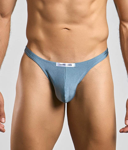A light blue form-fitting thong with a white justin simon label at the waistband from Justin plus Simon Classic Tanga