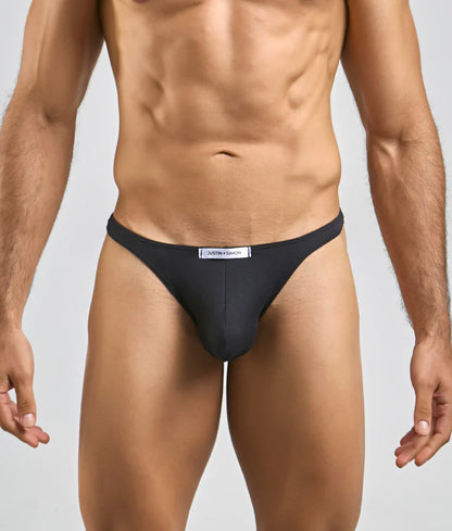 Black justin and samson briefs in peachskin material with sleek fit and white brand label on waistband