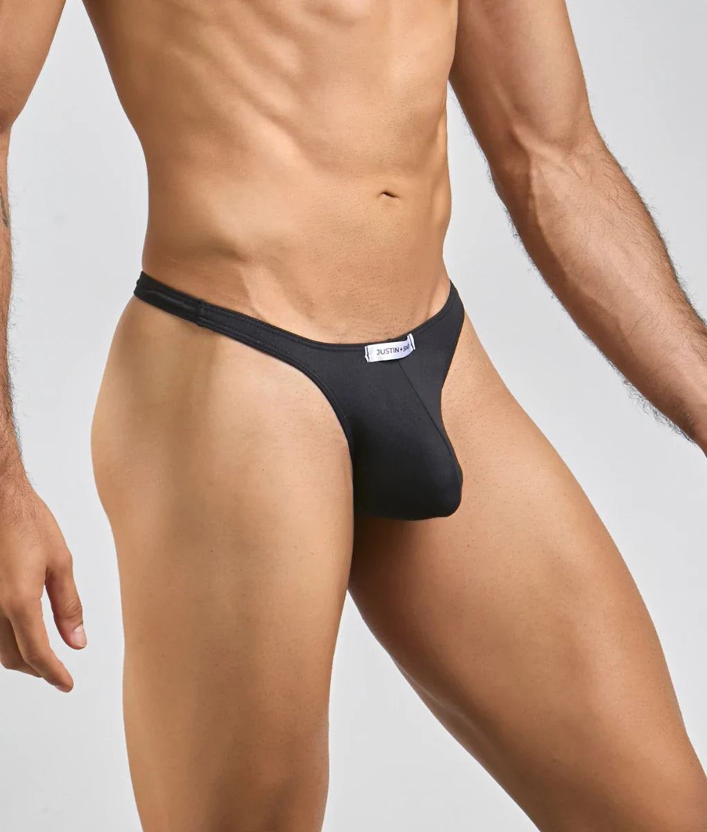 Black justbronze thong made of smooth form-fitting fabric with a sleek design and minimalistic waistband shown from back