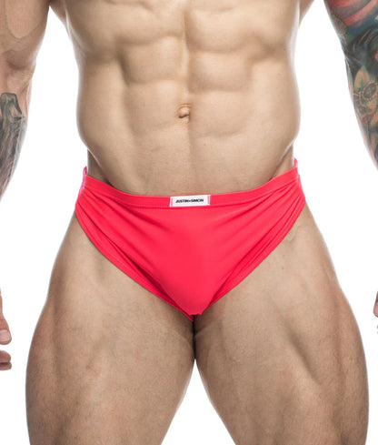 Justin + Simon running short final sale bright red form-fitting swim trunks with white brand label at the waistband