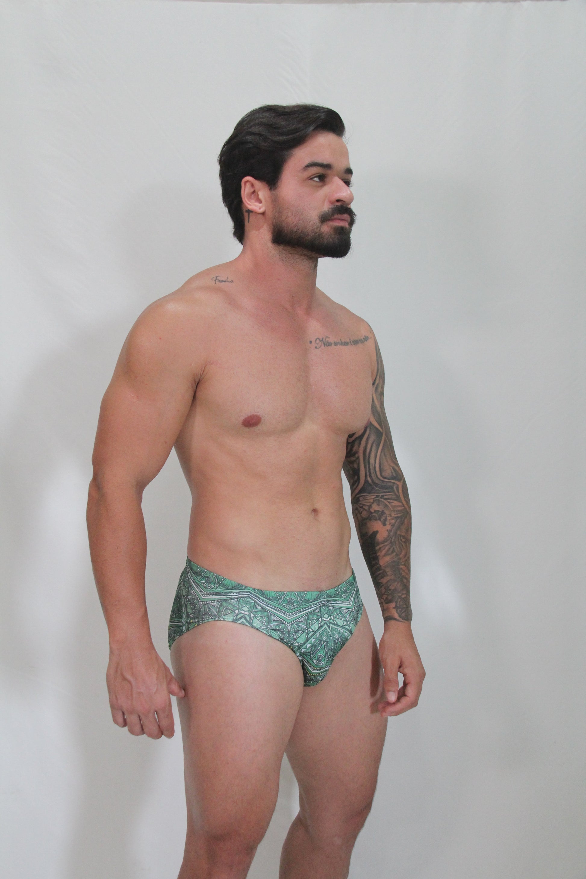 Green kaleidoscope swim brief with intricate geometric patterns made for comfortable swimwear use