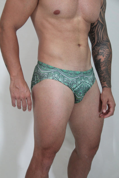 Kaleidoscope swim brief featuring green patterned fabric with intricate geometric designs for stylish swimming