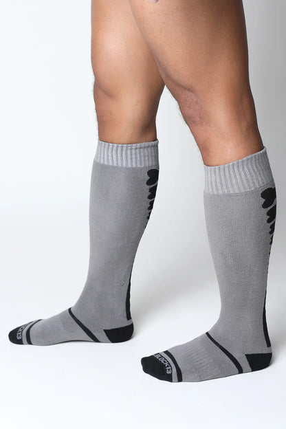 Kennel club bones knee high socks in gray with black accents ribbed cuffs and a subtle textured pattern