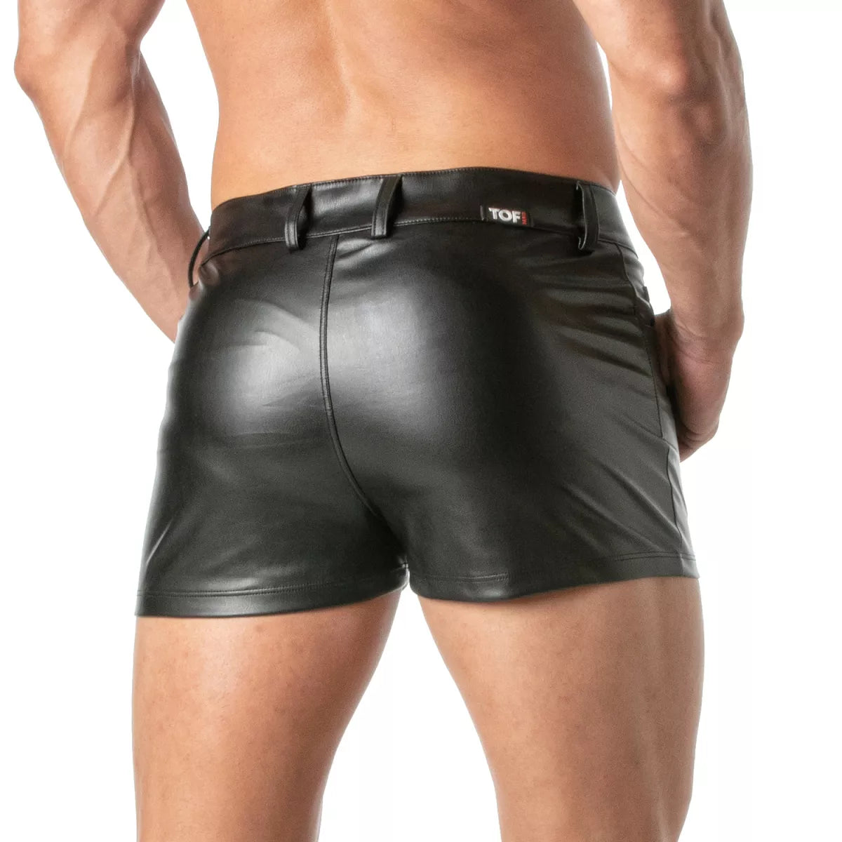 Black faux leather kinky mini shorts with a sleek glossy finish and a branded tof belt loop visible on the front