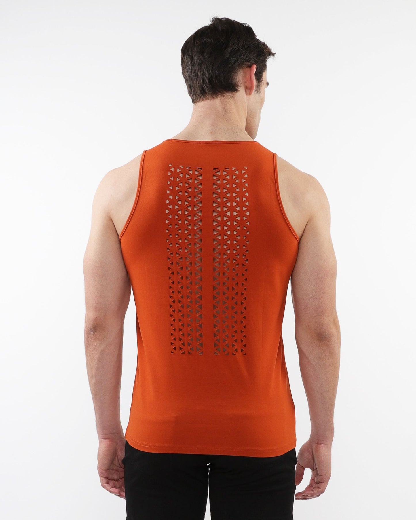 Orange laser cut stretch jersey tank with geometric perforation pattern shown from the back side