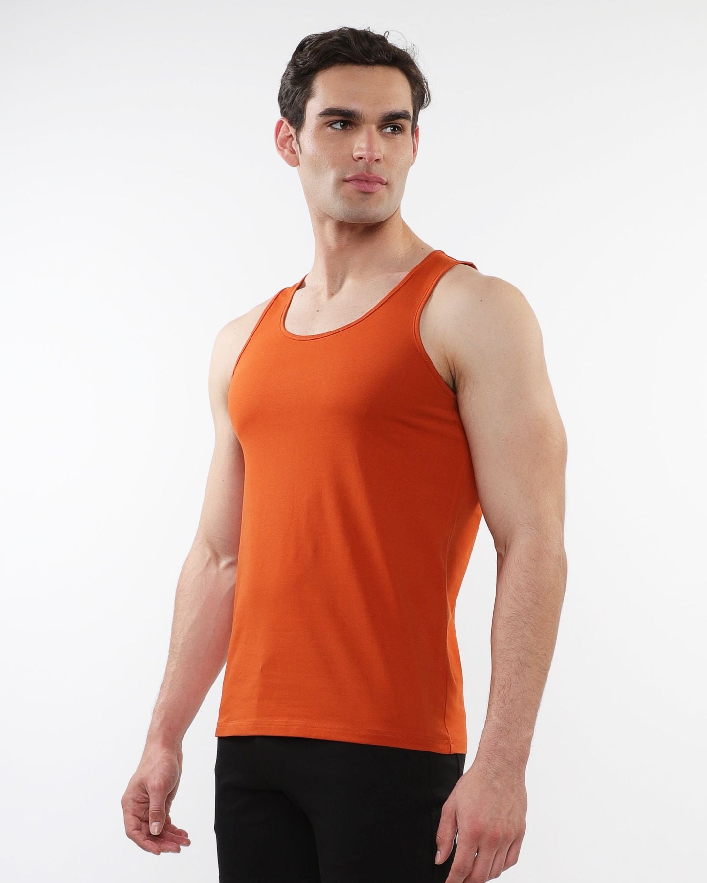 Orange sleeveless tank top made of laser cut stretch jersey for comfortable activewear use
