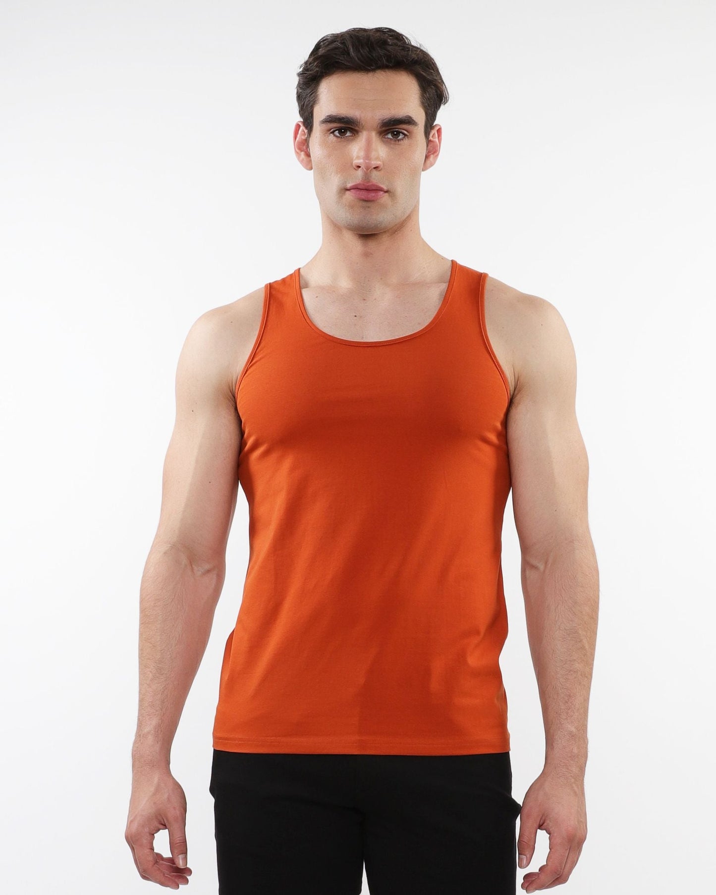 Orange sleeveless laser cut stretch jersey tank top designed for athletic performance and comfort