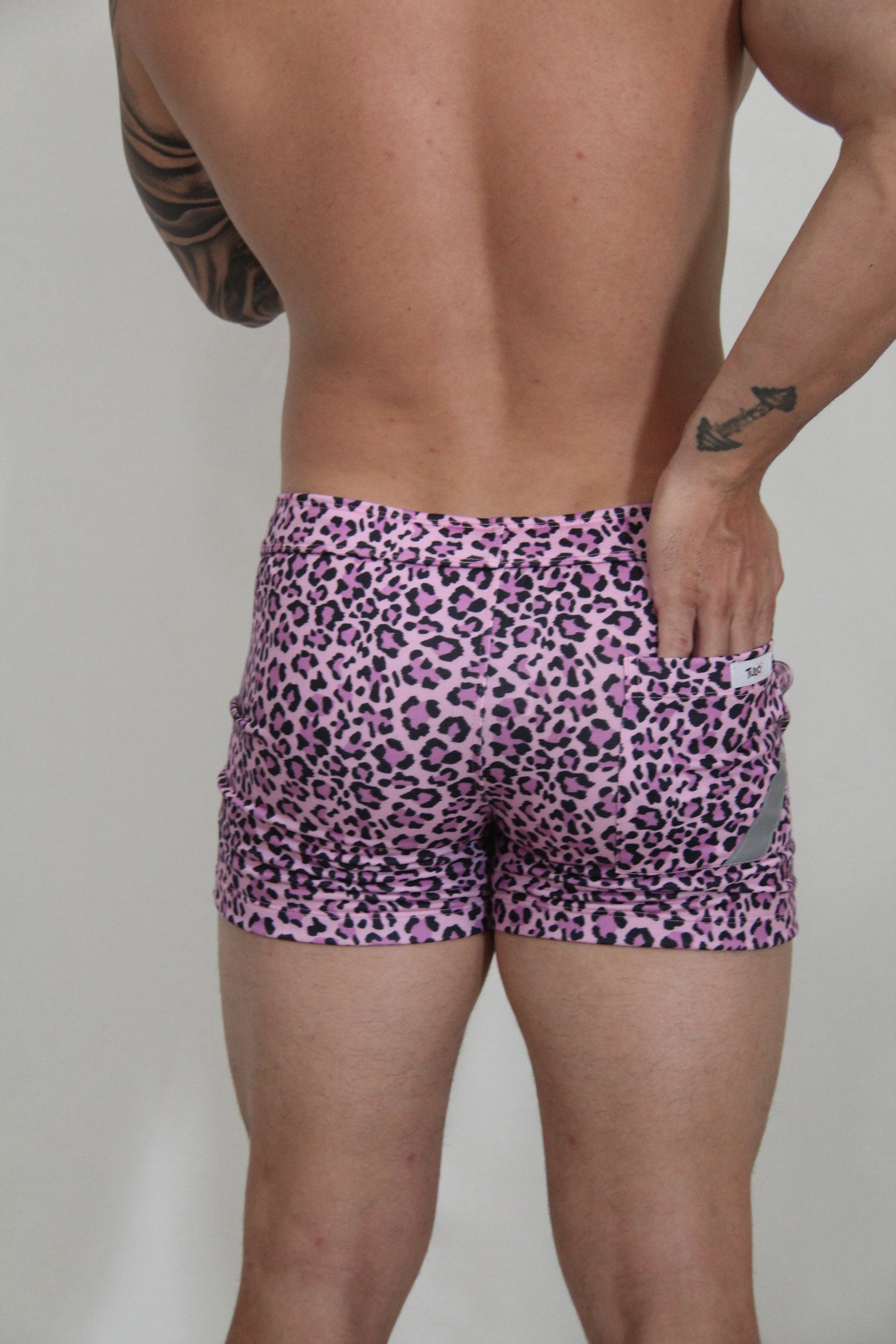Pink leopard-print fleece shorts with snug fit and elastic waistband for comfortable casual wear