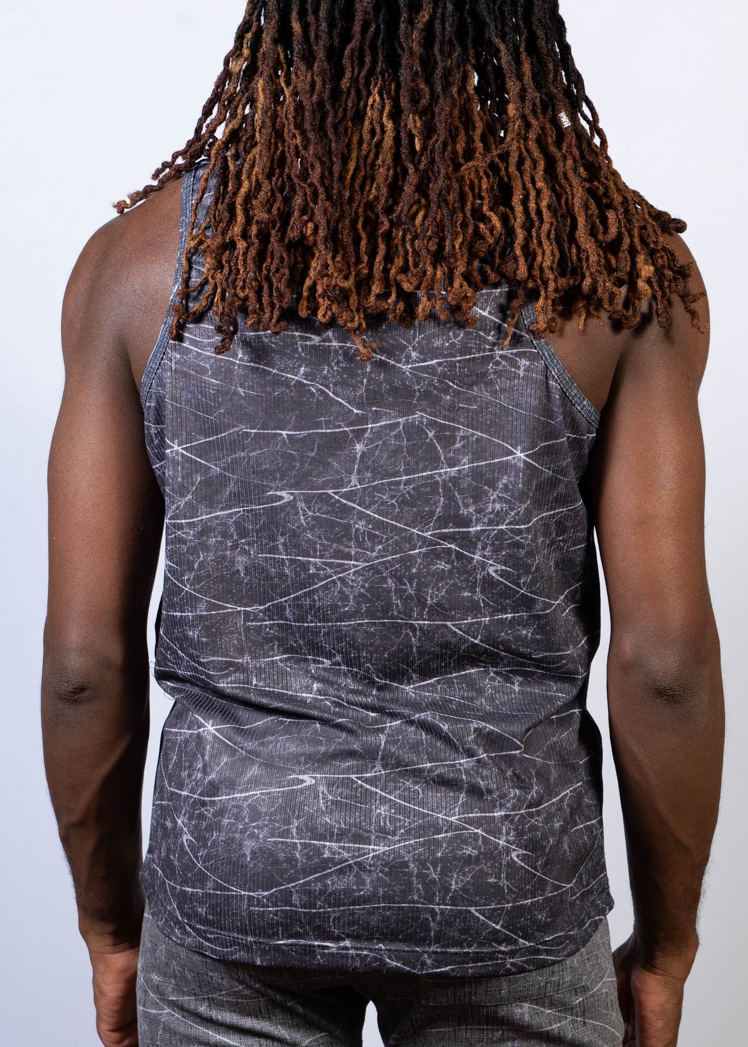 Black tank top with a white crackle lightning print pattern perfect for casual wear