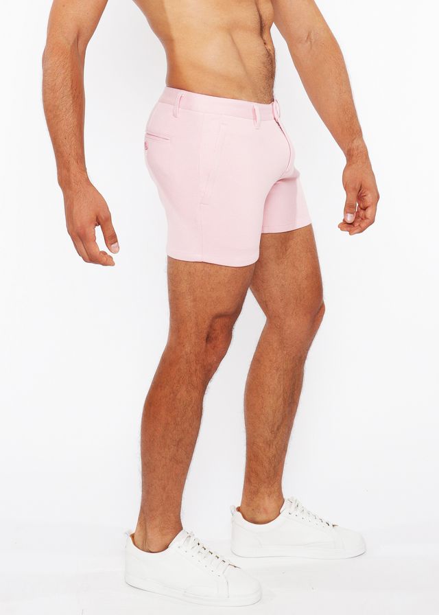Pink linen-look textured tailored shorts with a clean modern cut and subtle zip side pockets