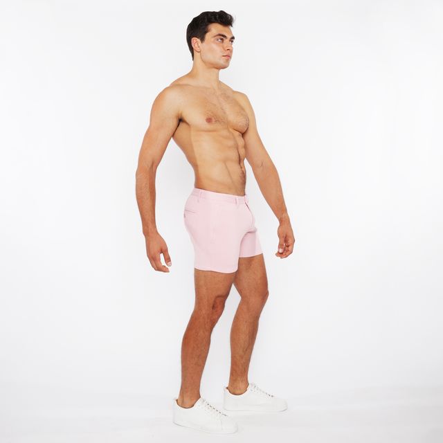 Pink linen-look textured athletic shorts with zip pockets and minimalist design