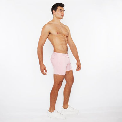 Pink linen-look textured athletic shorts with zip pockets and minimalist design