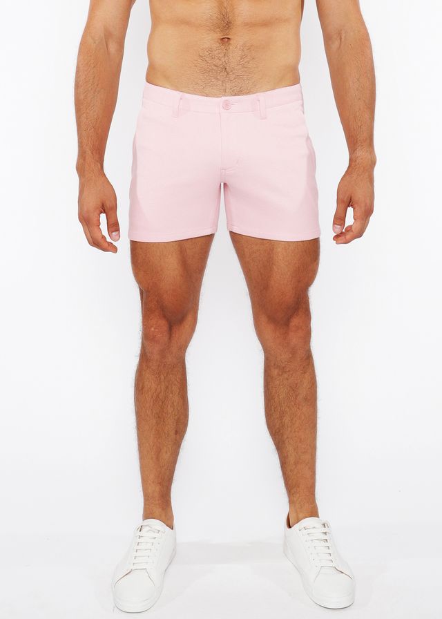 Pink linen-look textured men’s shorts with a clean tailored fit and subtle stitching details and zip pockets