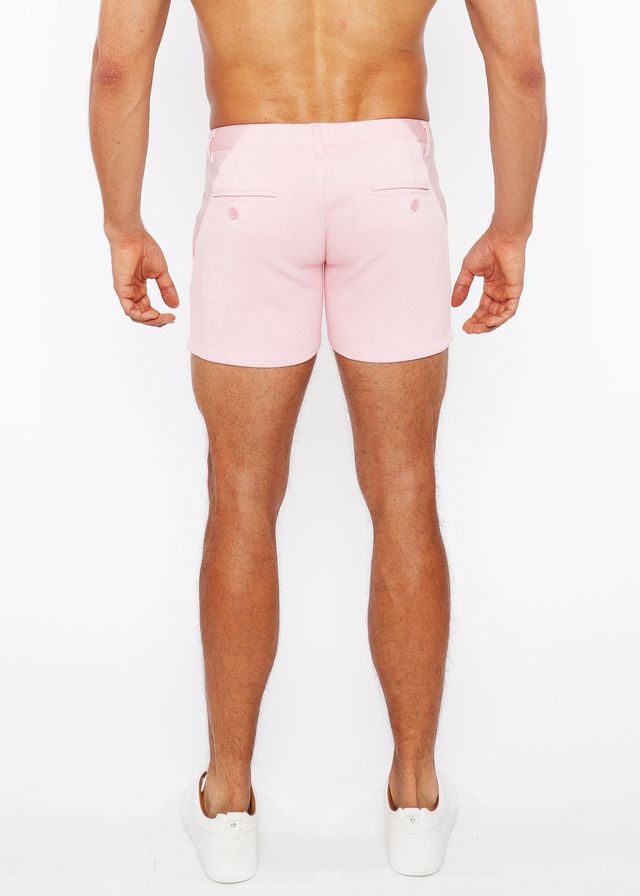 Pink linen-look textured men’s shorts with tailored fit and two back pockets shown from the back side