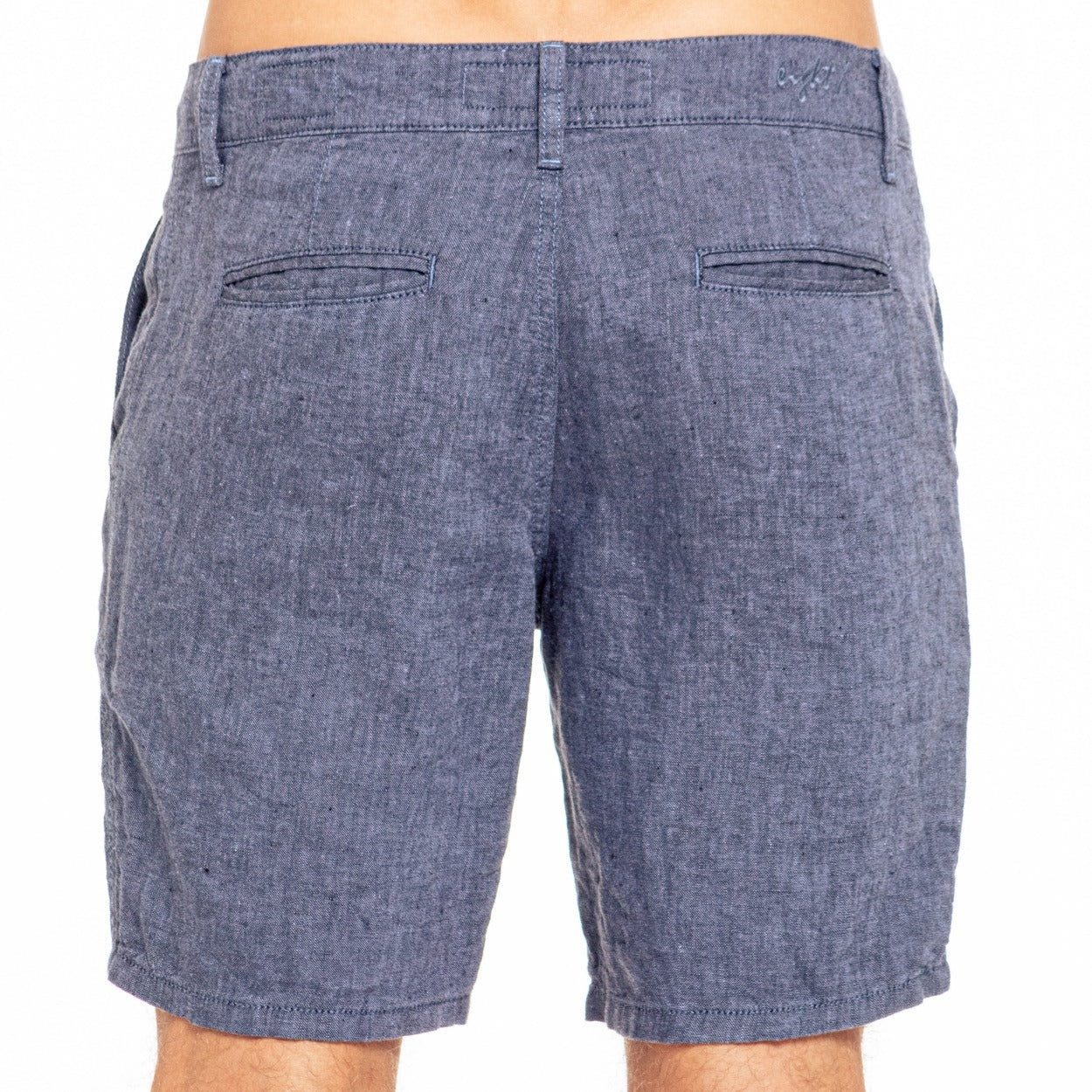 Blue linen slim fit shorts in denim with textured weave and two back pockets shown from the back side