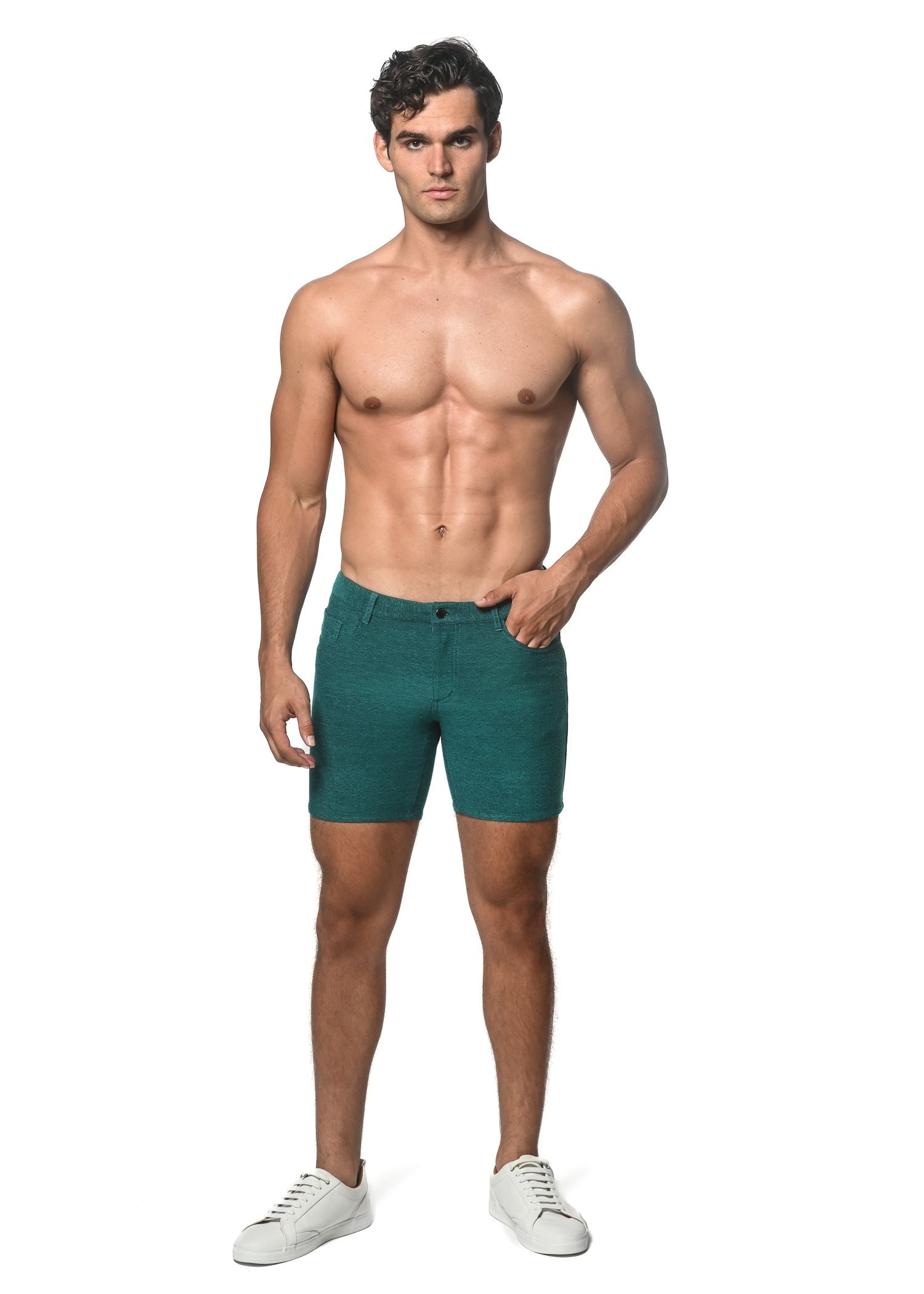 Teal-colored loopback stretch knit slim-fit denim shorts with five-pocket design and button closure
