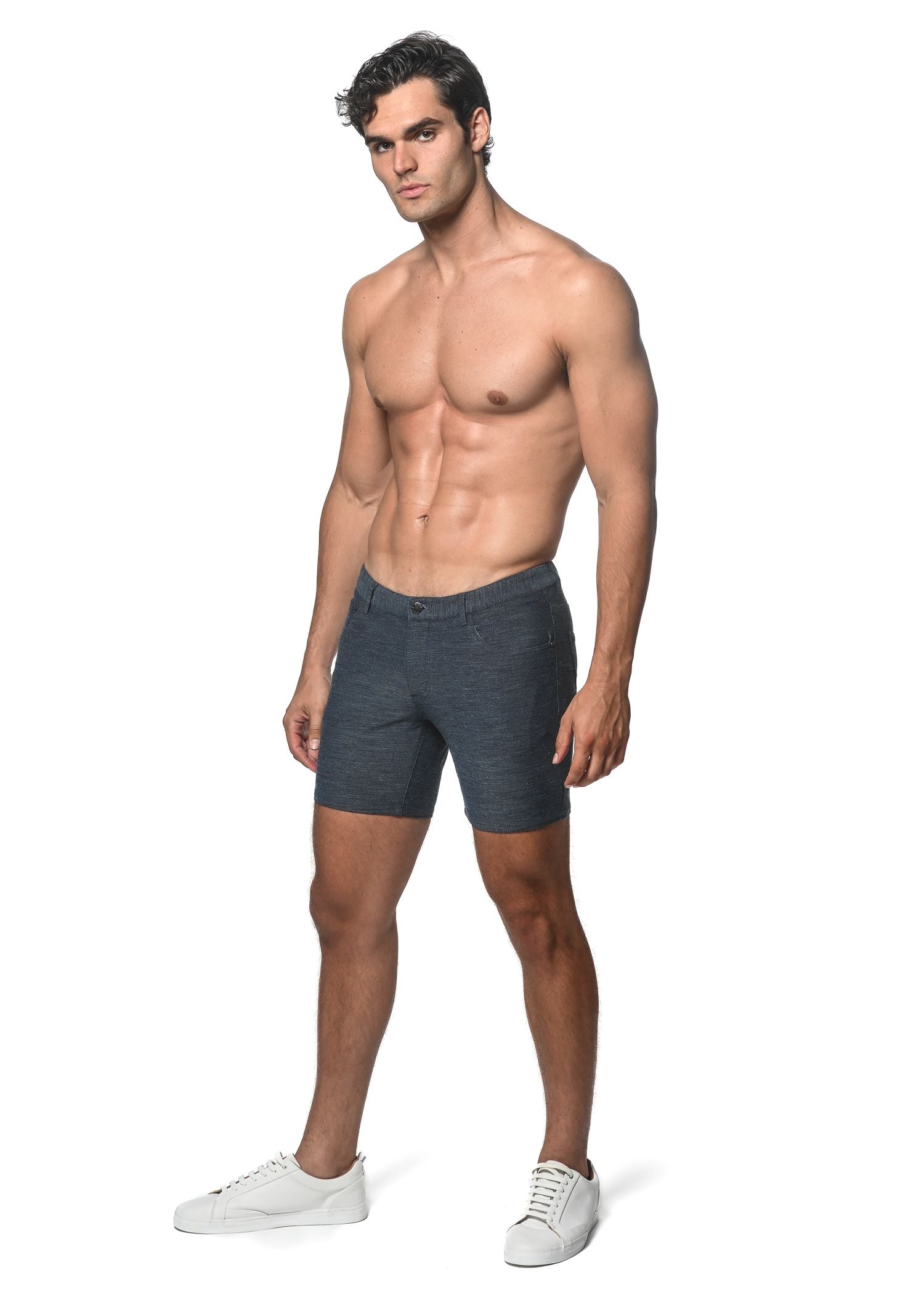 Dark gray loopback stretch knit shorts with textured fabric five-pocket design and button closure