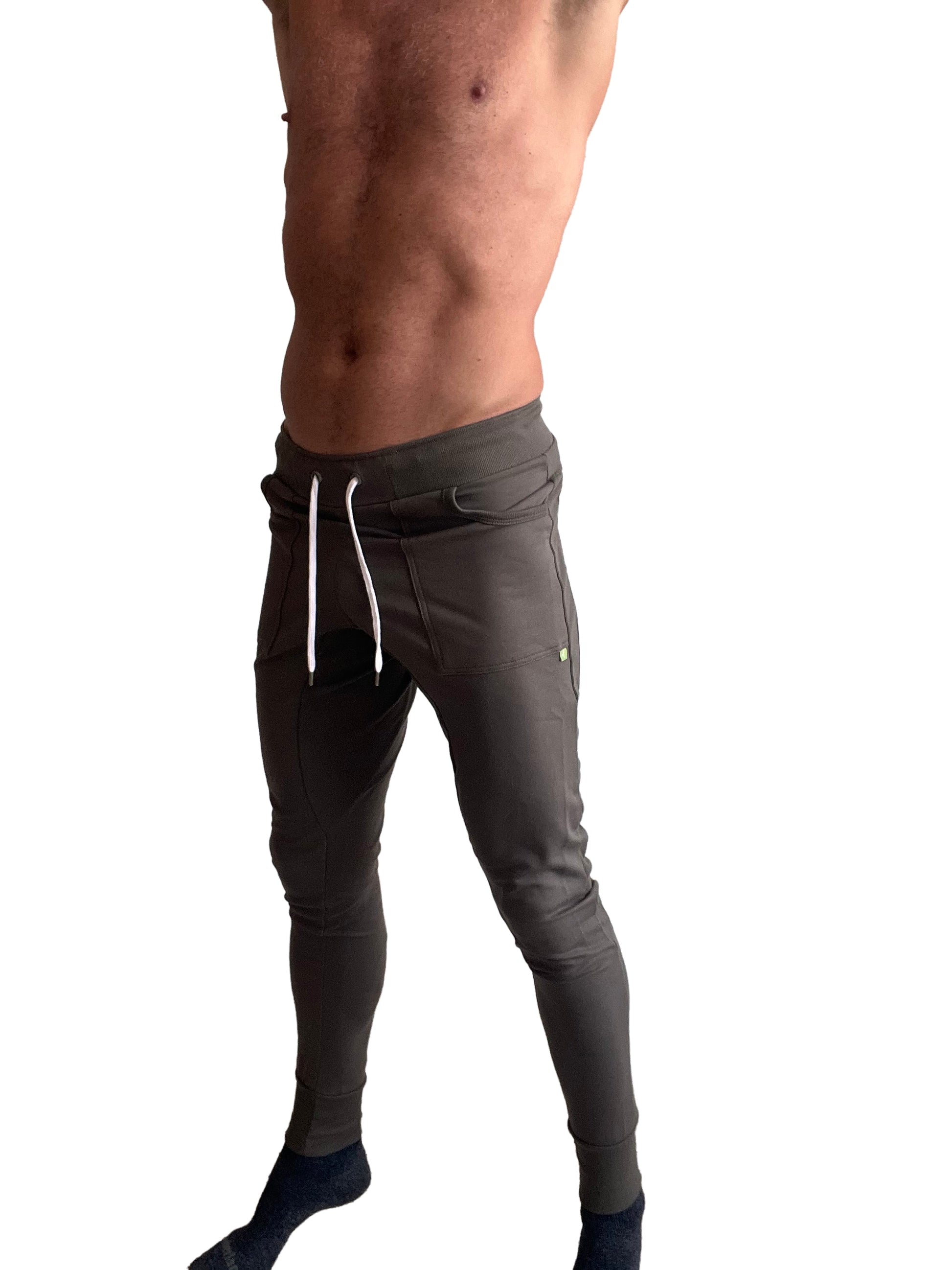Long cuffed jogger and yoga sweat pants in dark gray with white drawstrings and subtle side pocket detail