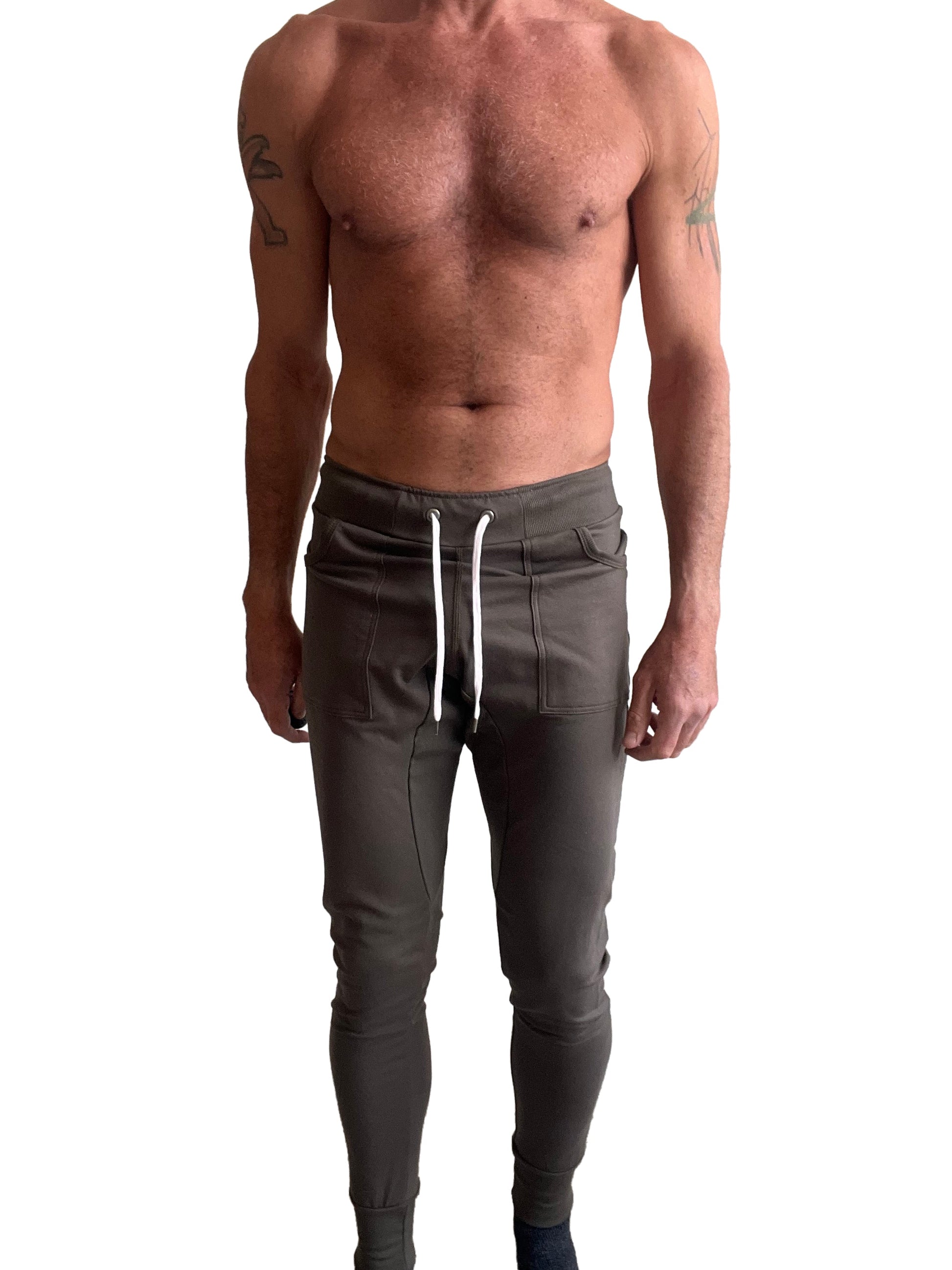 Long cuffed jogger and yoga sweat pants in dark olive with white drawstrings and side pockets for comfortable wear