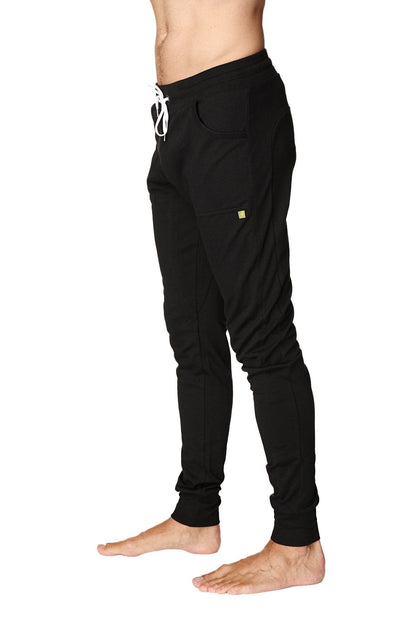 Long cuffed jogger and yoga sweat pants in black with white drawstring and small yellow logo on the thigh