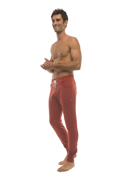 Long cuffed jogger and yoga sweat pants cinnabar red with white drawstring and side pockets for athletic use