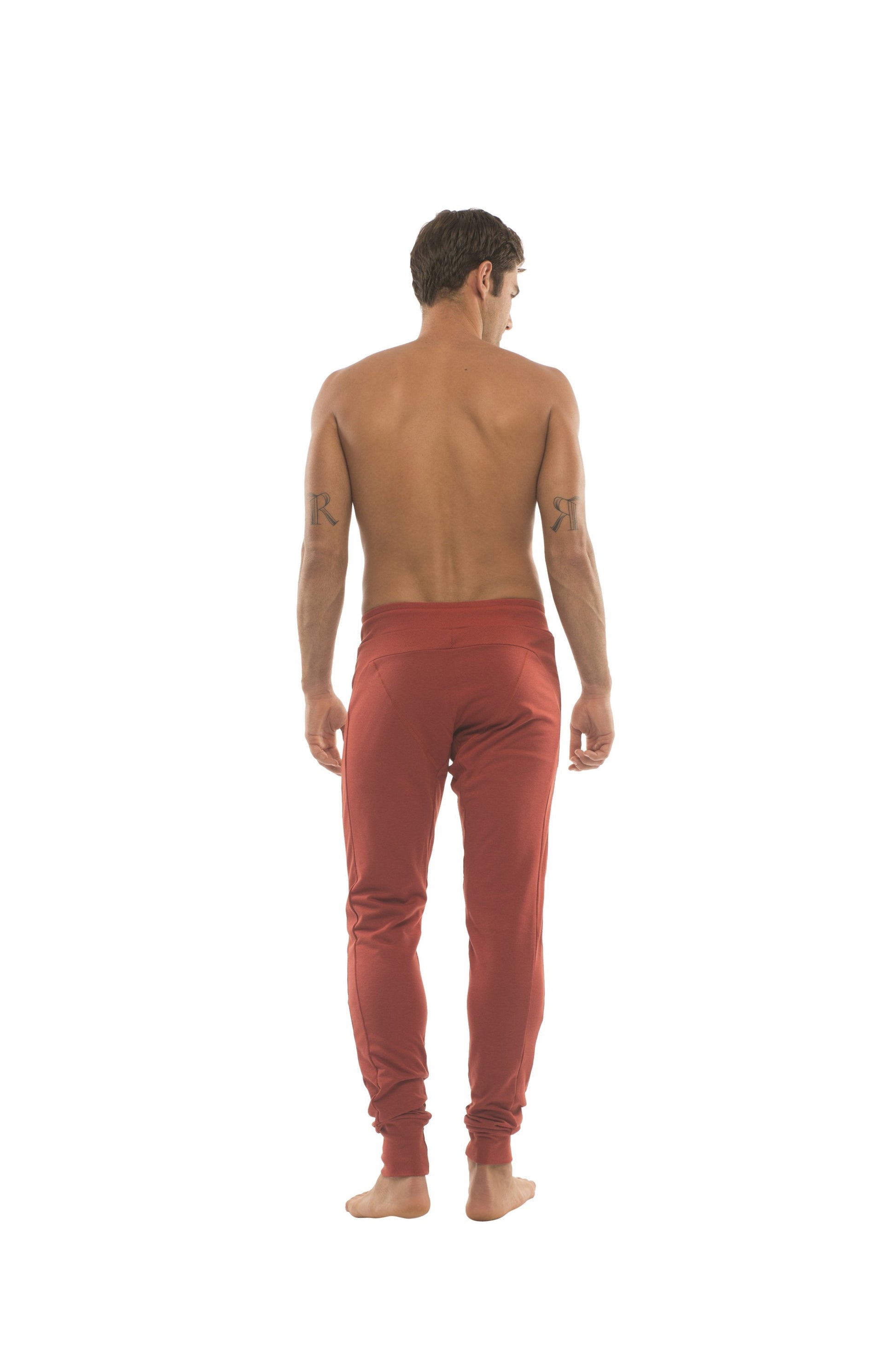 Long cuffed jogger and yoga sweat pants in cinnabar red with high waistband and tapered legs for active wear