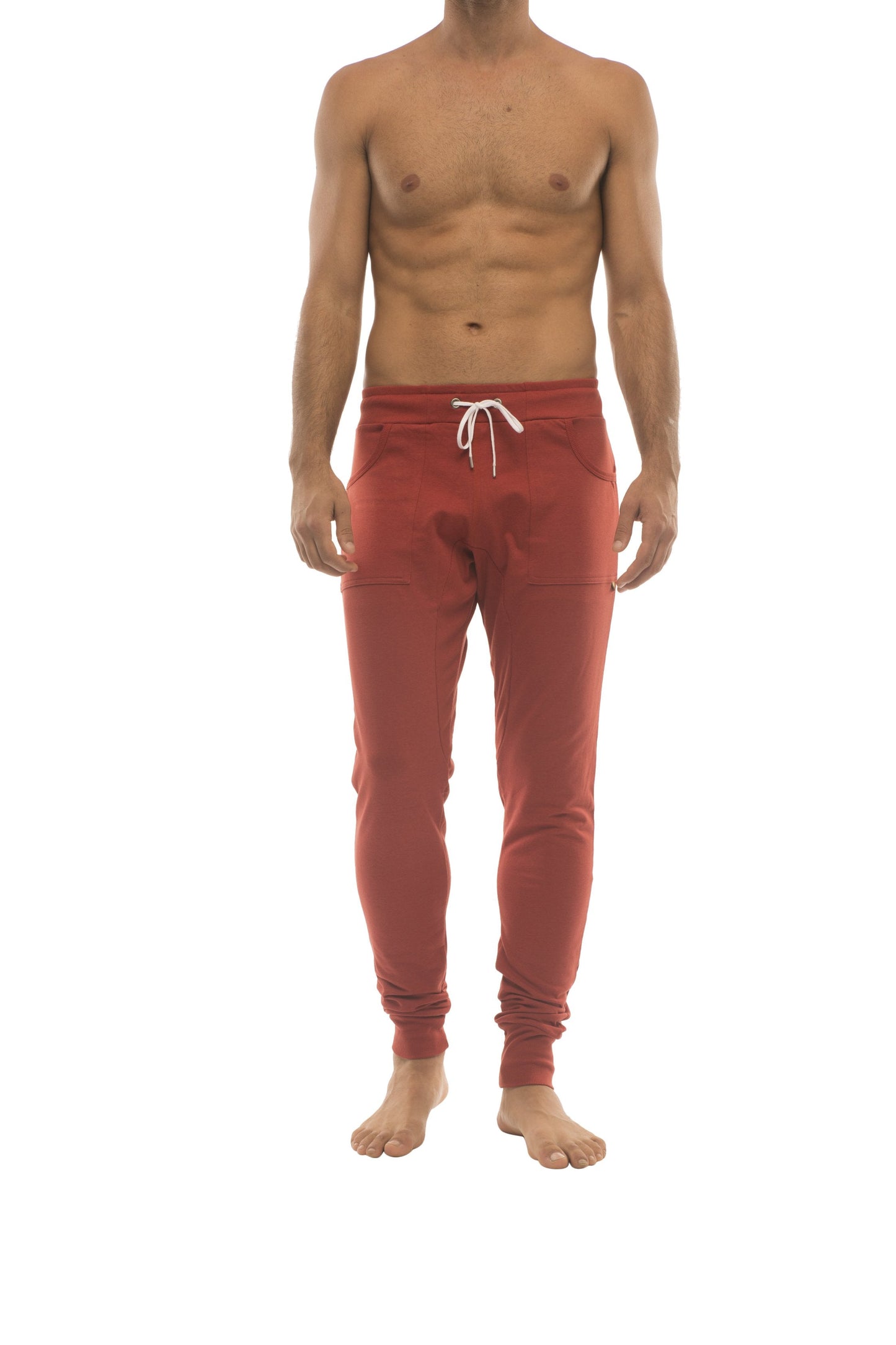 Long cuffed jogger and yoga sweat pants in cinnabar red with white drawstring waistband and elastic cuffs