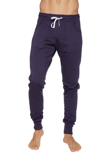 Long cuffed navy blue jogger pants with white drawstring and side pockets for casual comfort and yoga