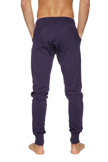 Long cuffed jogger and yoga sweat pants in dark purple soft fabric with elastic cuffs and a relaxed fit