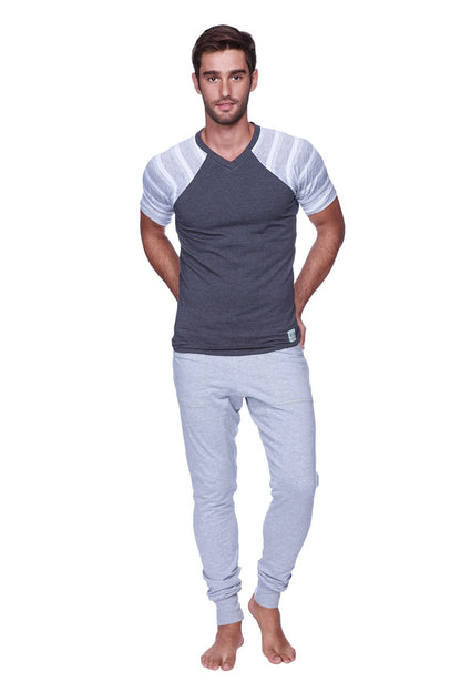 Men’s gray and white striped raglan sleeve v-neck t-shirt paired with heather grey long cuffed jogger and yoga sweat pants