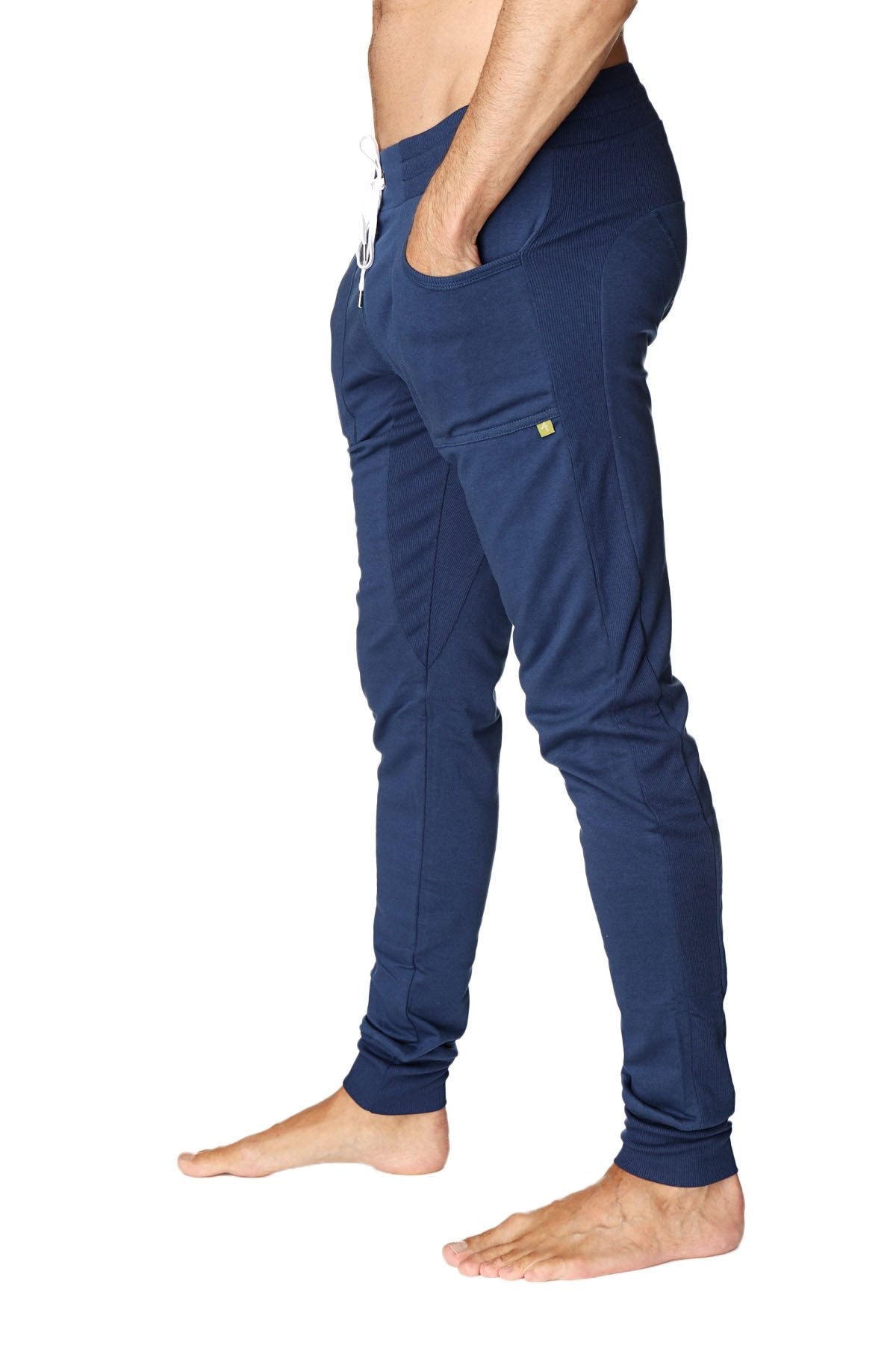 Royal blue long cuffed jogger and yoga sweat pants with white drawstring and lime green logo on thigh pocket