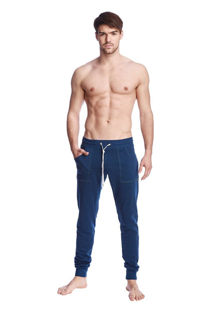 Navy blue long cuffed jogger and yoga sweat pants with white drawstring and side pockets for comfortable wear