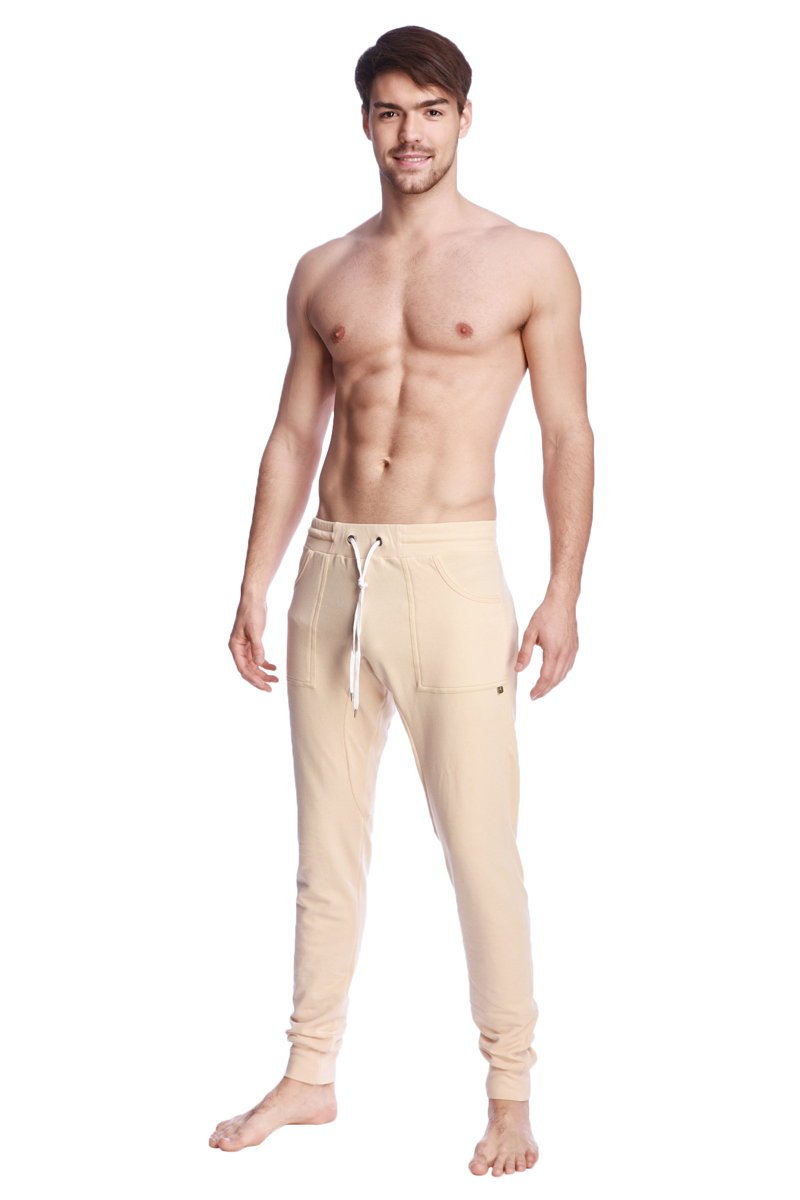 Beige long cuffed jogger and yoga sweat pants with drawstring waistband and side pockets for comfortable wear