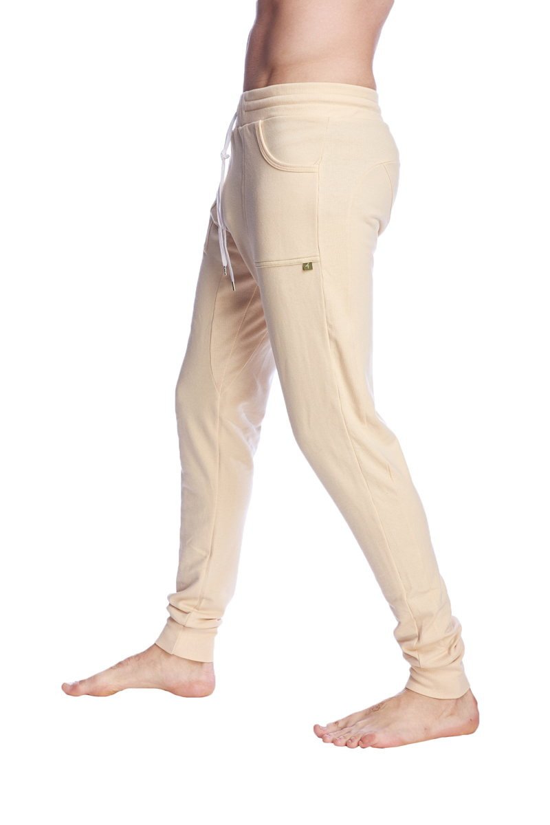 Beige long cuffed jogger and yoga sweat pants with drawstring waistband and elastic cuffs for comfortable wear