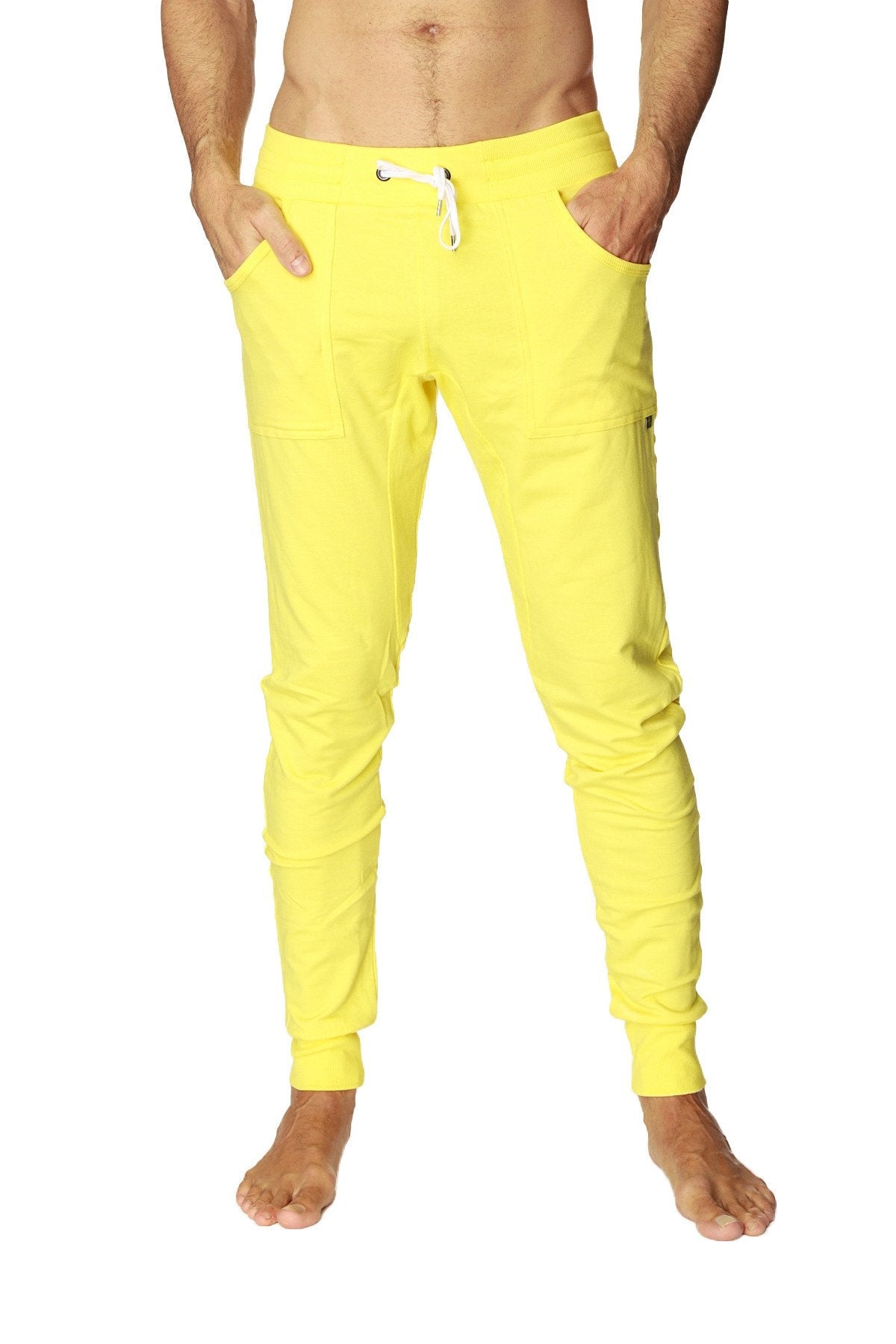 Bright yellow long cuffed jogger and yoga sweat pants with white drawstring waistband and side pockets